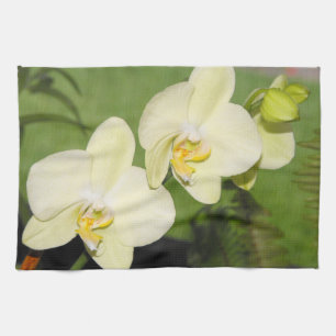 White Orchids on a green background Tea Towel
