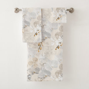 White orchids on a light cream bath towel set