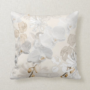 White orchids on a light cream cushion