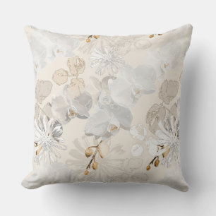 White orchids on a light cream cushion