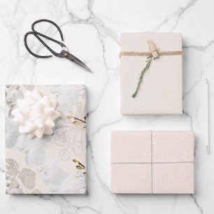 White orchids on a light cream   wrapping paper sheet