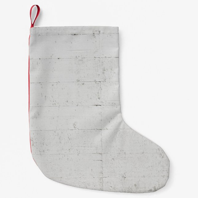 White painted concrete wall concrete small christmas stocking (Front)