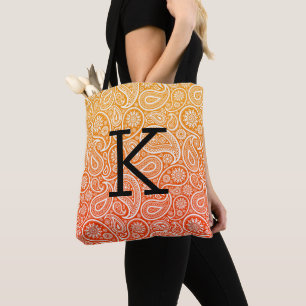 White paisley pattern on red to yellow ombre tote bag