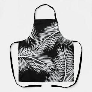 White palm leaves on black colour background apron