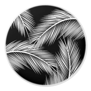 White palm leaves on black colour background ceramic knob