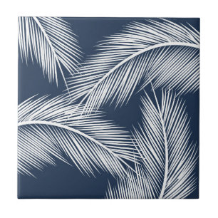 White palm leaves on dark blue colour background ceramic tile