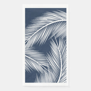 White palm leaves on dark blue colour background napkin