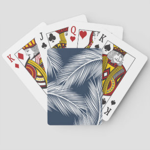 White palm leaves on dark blue colour background playing cards
