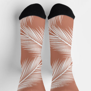 White palm leaves on terracotta colour background socks