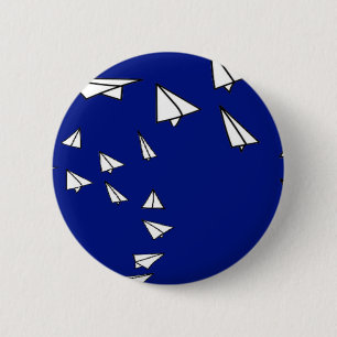 White paper planes on blue 6 cm round badge
