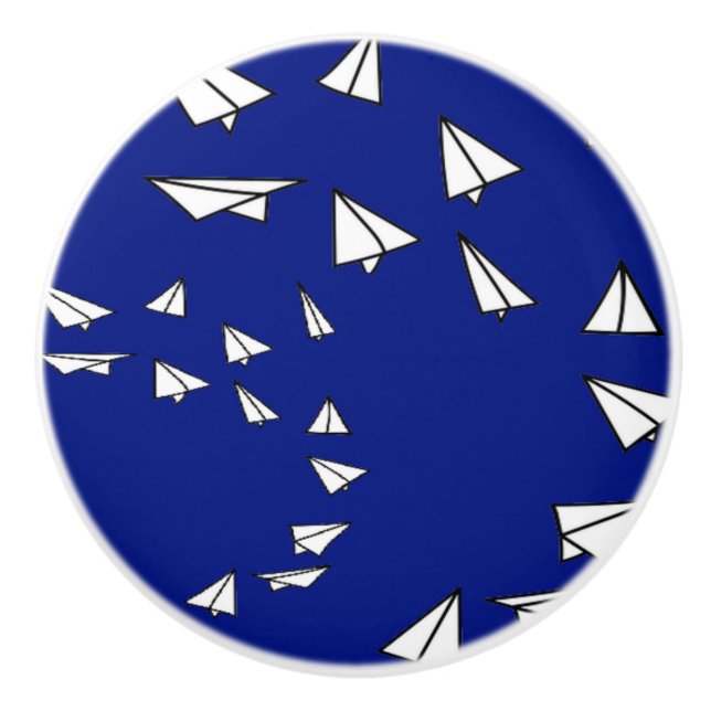White paper planes on blue ceramic knob (Front)