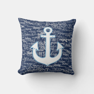 white pattern of names & boat anchor, on blue outdoor cushion