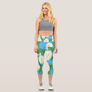 White peace lilies on pale blue background  capri leggings