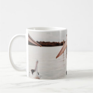 WHITE PELICAN ON BODY OF WATER DURING DAYTIME COFFEE MUG