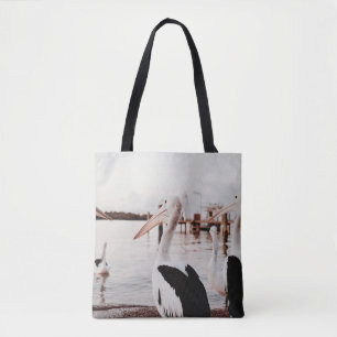 WHITE PELICAN ON BODY OF WATER DURING DAYTIME TOTE BAG