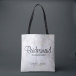 White Peony Flowers & Hearts Bridesmaid Wedding Tote Bag<br><div class="desc">This beautiful tote bag is perfect for thanking your bridesmaids. It features modern black script lettering over a background of reflecting white peony flowers and hearts. The text is fully customisable and reads: Bridesmaid, with a place for her name, the couple's names and wedding date. Perfect for filling with wedding...</div>