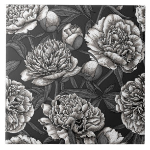 White peony flowers on dark grey ceramic tile