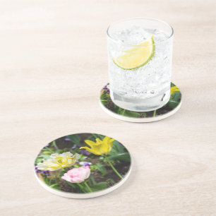 White, pink and yellow tulips in the garden   coaster