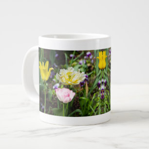 White, pink and yellow tulips in the garden     large coffee mug