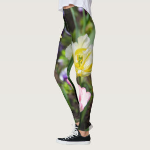 White, pink and yellow tulips in the garden leggings