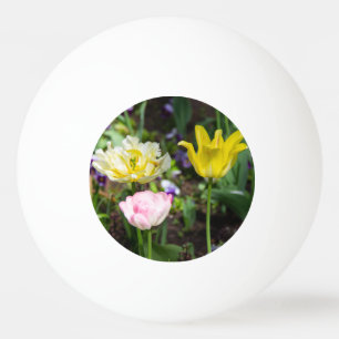 White, pink and yellow tulips in the garden ping pong ball