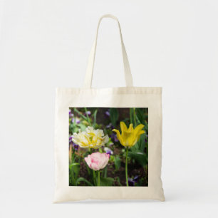 White, pink and yellow tulips in the garden tote bag