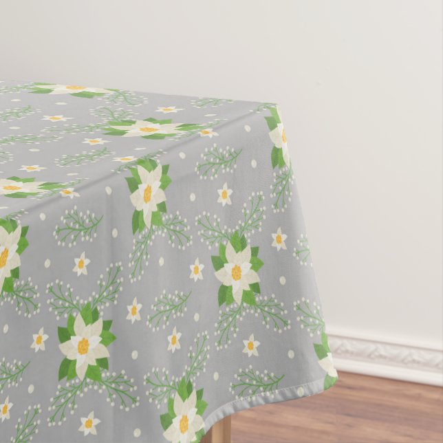White Poinsettias Green Leaves Christmas on Grey Tablecloth (In Situ)