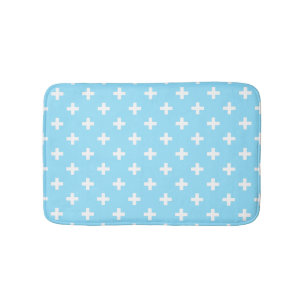 White polka crosses on baby blue bath mat