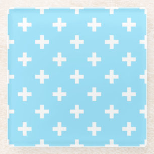 White polka crosses on baby blue glass coaster