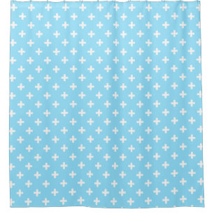 White polka crosses on baby blue shower curtain
