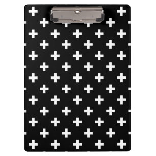 White polka crosses on black clipboard