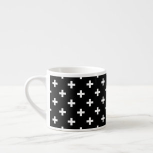 White polka crosses on black espresso cup