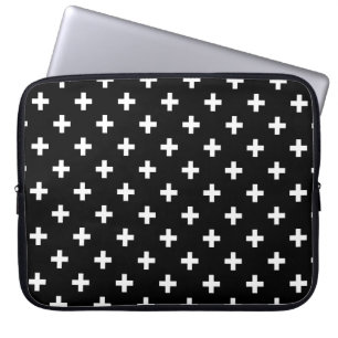 White polka crosses on black laptop sleeve