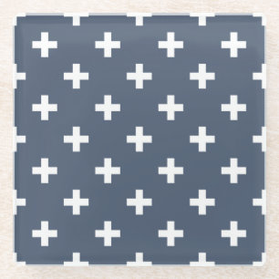 White polka crosses on blue-grey glass coaster