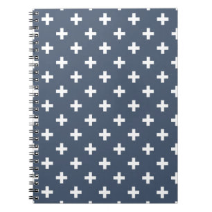 White polka crosses on blue-grey notebook