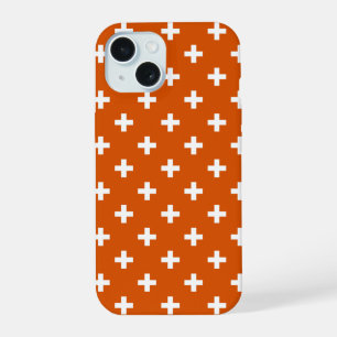 White polka crosses on burnt orange iPhone 15 case