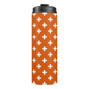 White polka crosses on burnt orange thermal tumbler