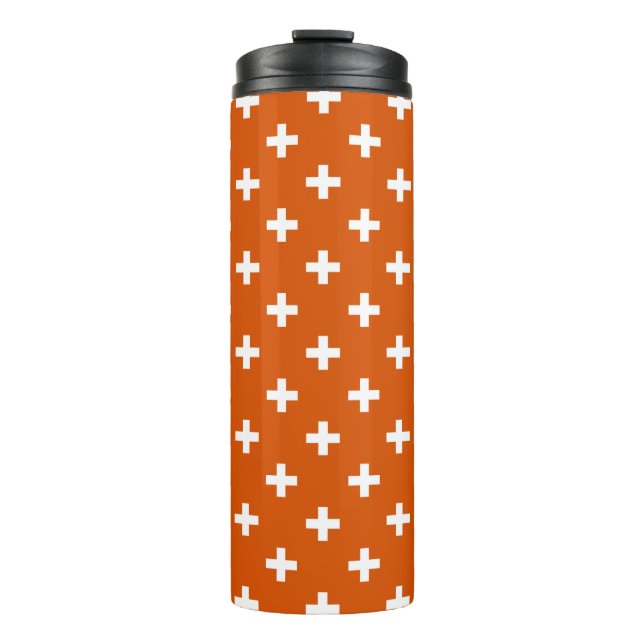 White polka crosses on burnt orange thermal tumbler (Front)