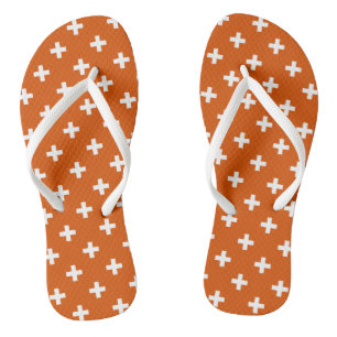 White polka crosses on burnt orange thongs
