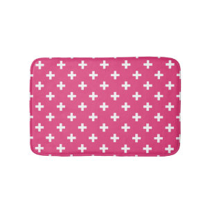 White polka crosses on fuchsia bath mat