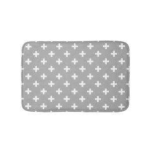 White polka crosses on grey bath mat