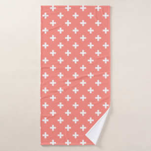 White polka crosses on peach bath towel