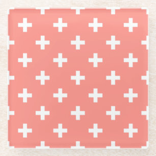 White polka crosses on peach glass coaster