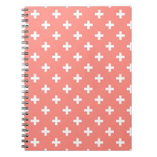 White polka crosses on peach notebook