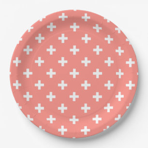 White polka crosses on peach paper plate