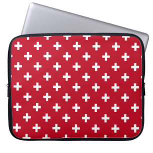 White polka crosses on red laptop sleeve