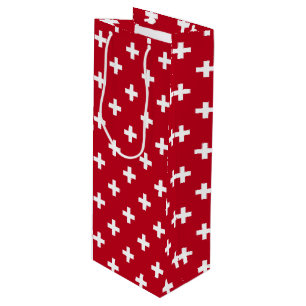 White polka crosses on red wine gift bag