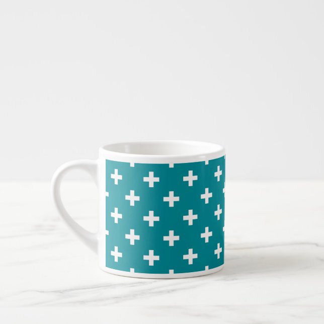 White polka crosses on teal espresso cup (Left)