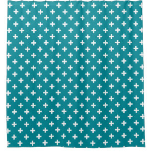 White polka crosses on teal shower curtain