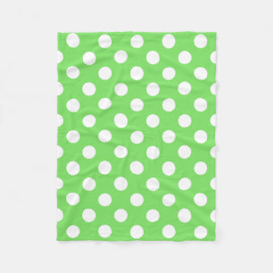 White polka dots on apple green fleece blanket